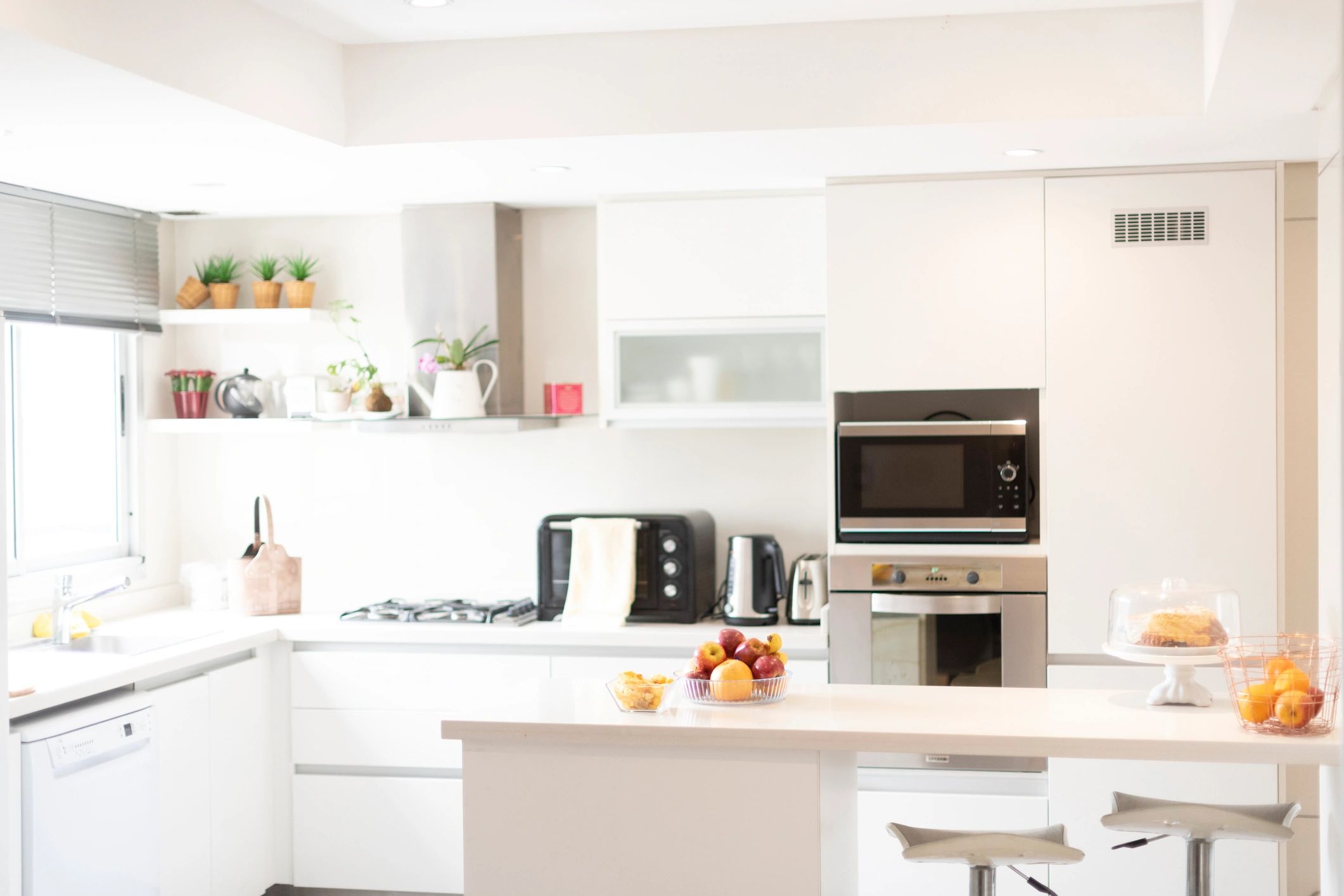 Modern kitchen with counter and natural sunlight