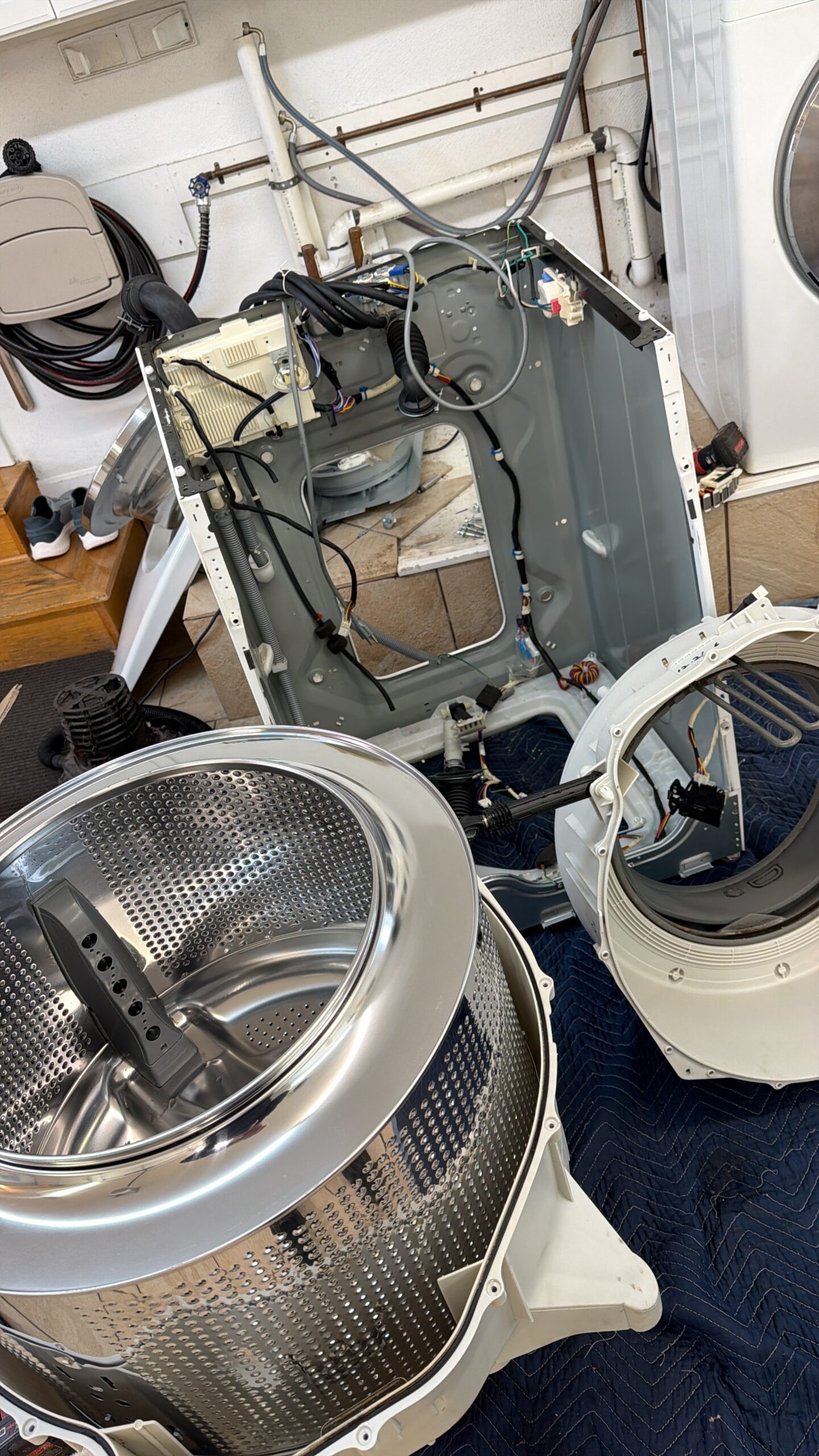 Interior of a front-loading washing machine during preventive maintenance service